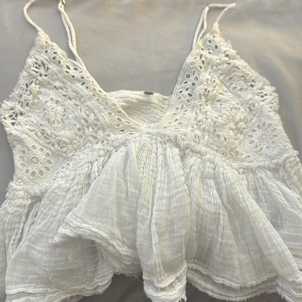 A fluffy white tank top from buckle.